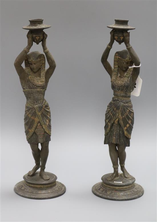 A pair of Egyptian spelter candlesticks height 38.5cm